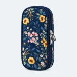 Petit sac isotherme médicaments à motif fleurs jaunes et roses sur fond bleu nuit, format compact à double zip