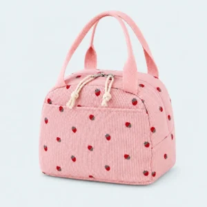 Petit sac isotherme en velours côtelé rose à motif fraises, avec deux anses et poche avant