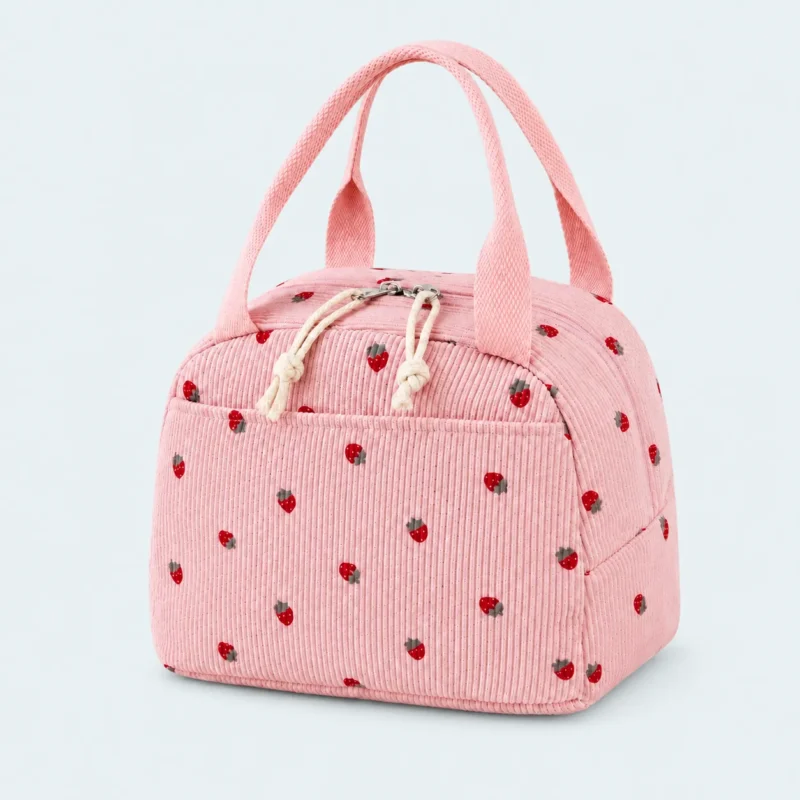 Petit sac isotherme en velours côtelé rose à motif fraises, avec deux anses et poche avant