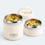 Boîte repas isotherme inox 2 étages ouverte avec soupe et riz aux légumes